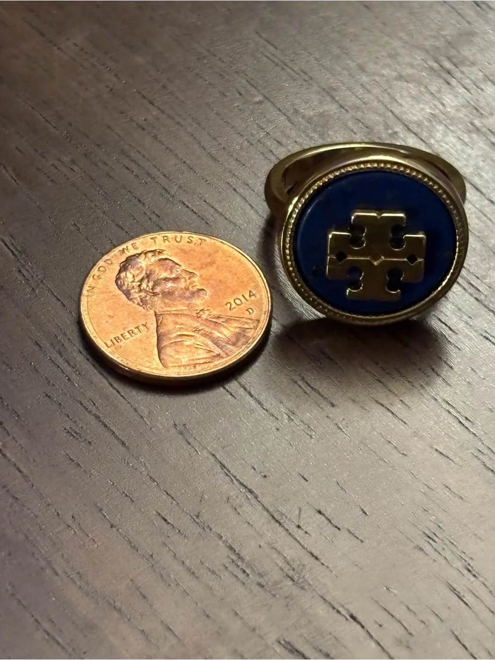 Tory Burch Gold-plated Ring with Deep Blue cover Logo.